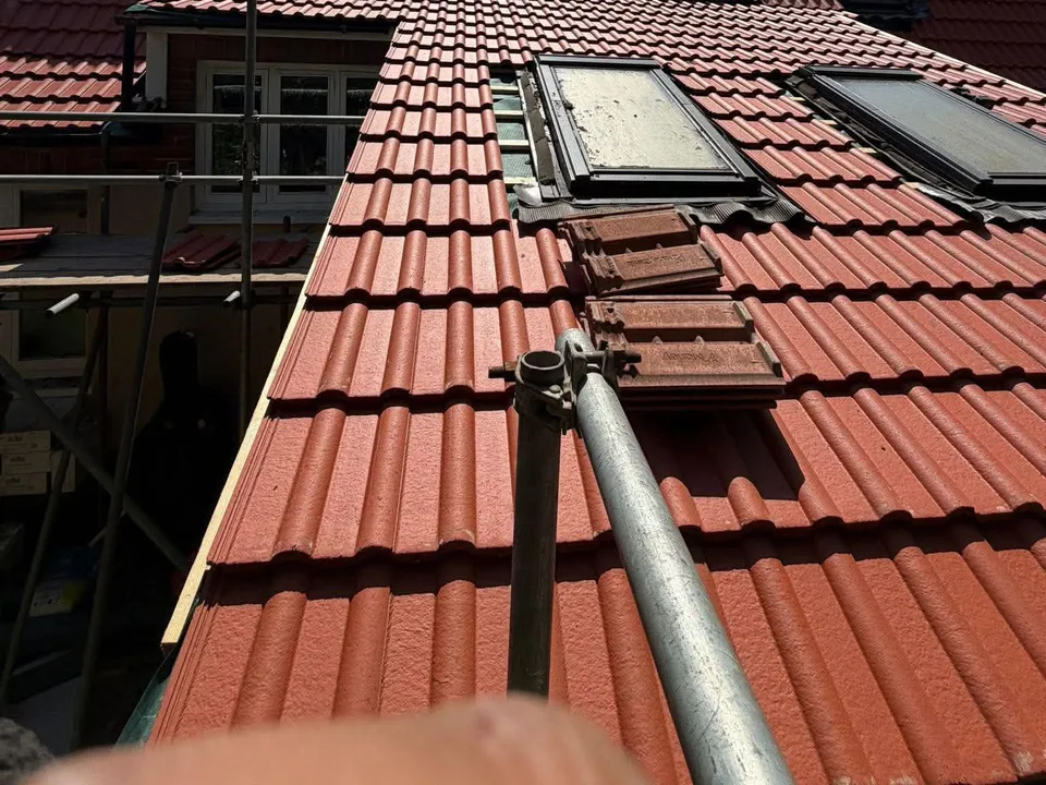 A new red tiled roof with rooflights, fitted by JWJ during a full re-roof